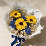Top view of the Adore soap flower bouquet of three sunflowers with blue hydrangea, baby’s breath and caspia