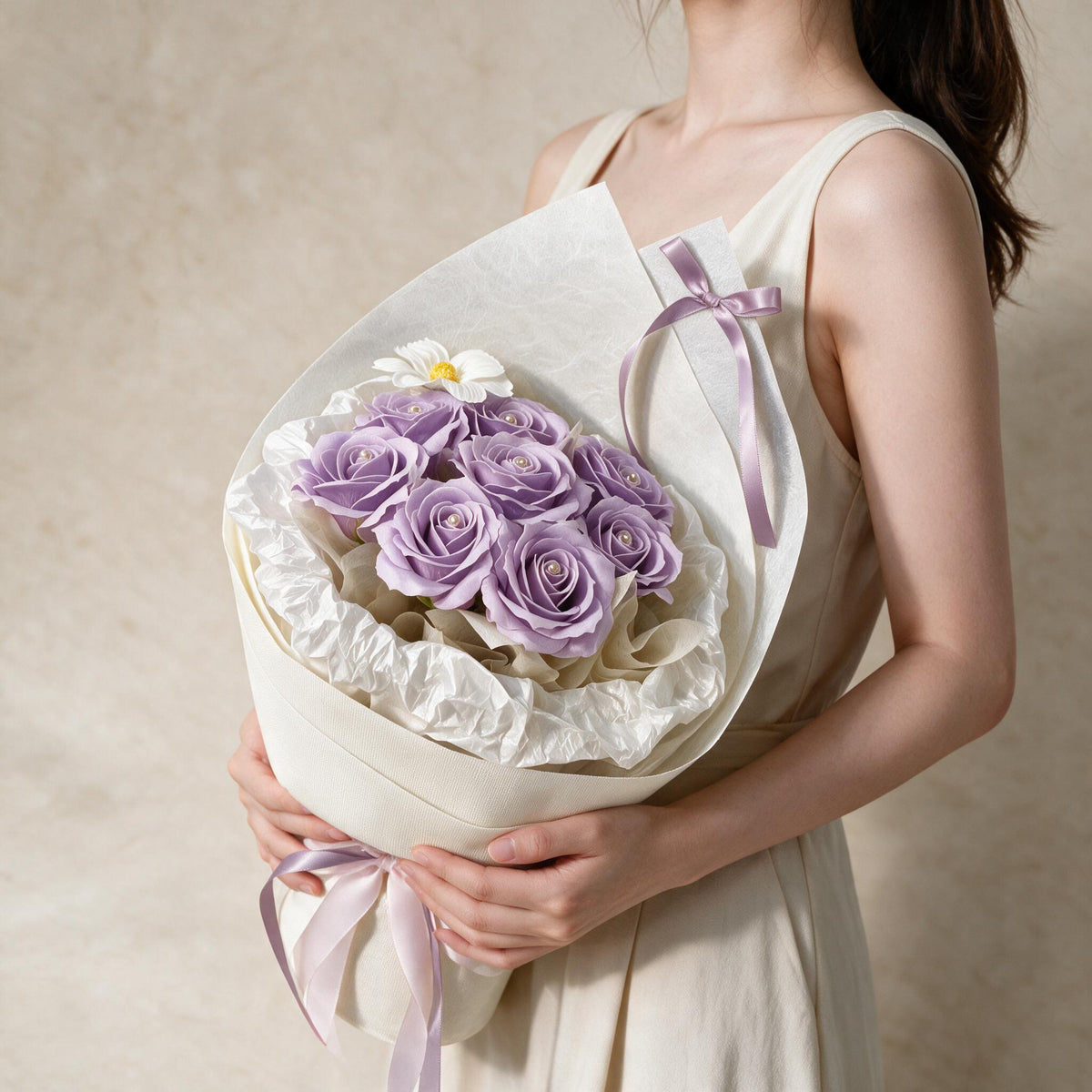 Woman holding the lilac Always Yours soap flower bouquet in cream wrap