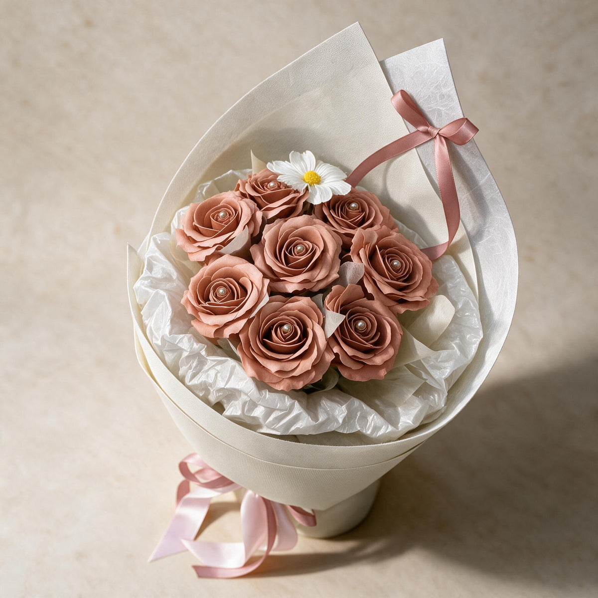 Top view of the Always Yours soap flower bouquet of eight dusty pink roses and a cosmos