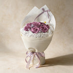 Always Yours soap flower bouquet of eight purple roses and a cosmos in cream wrap