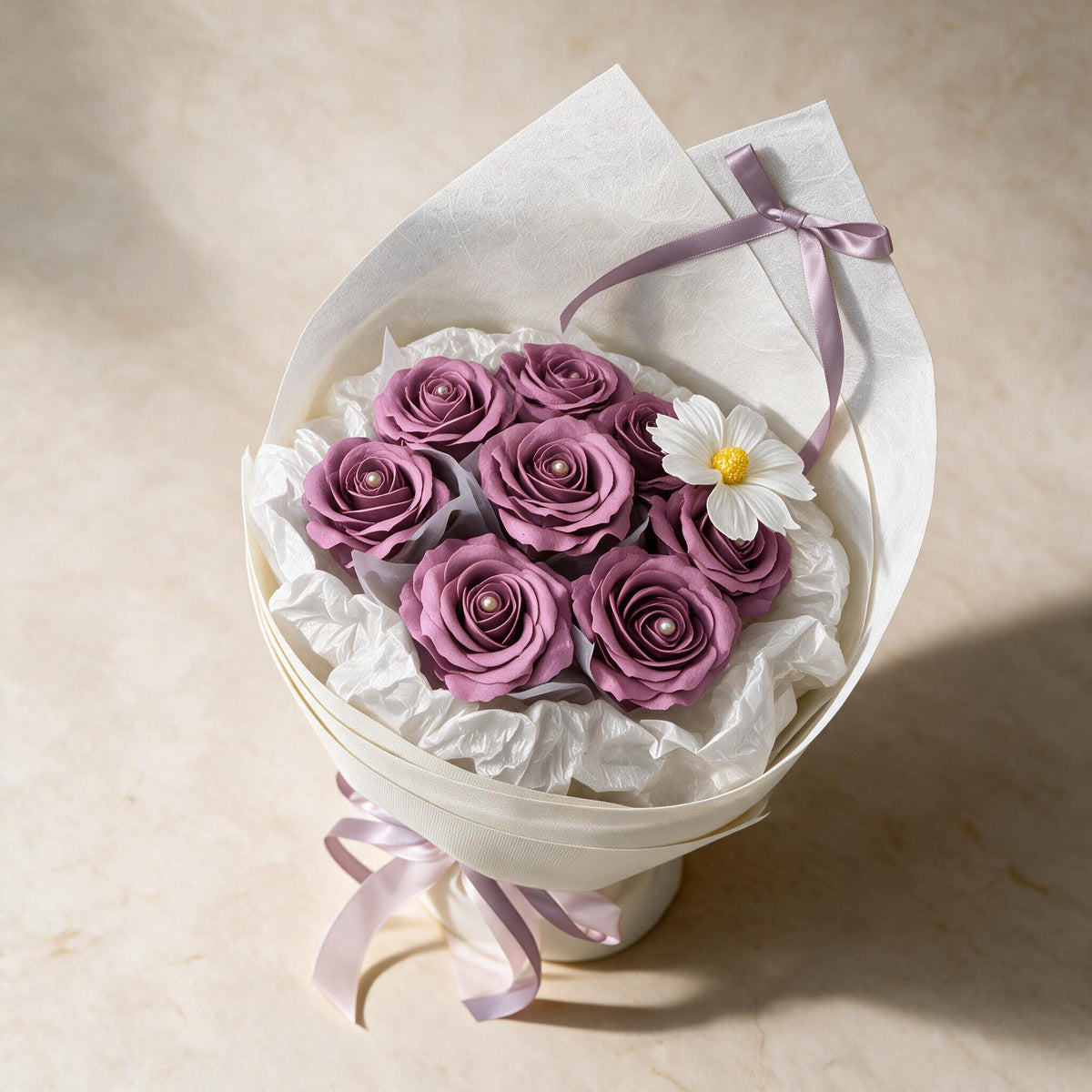 Top view of the Always Yours soap flower bouquet of eight purple roses and a cosmos