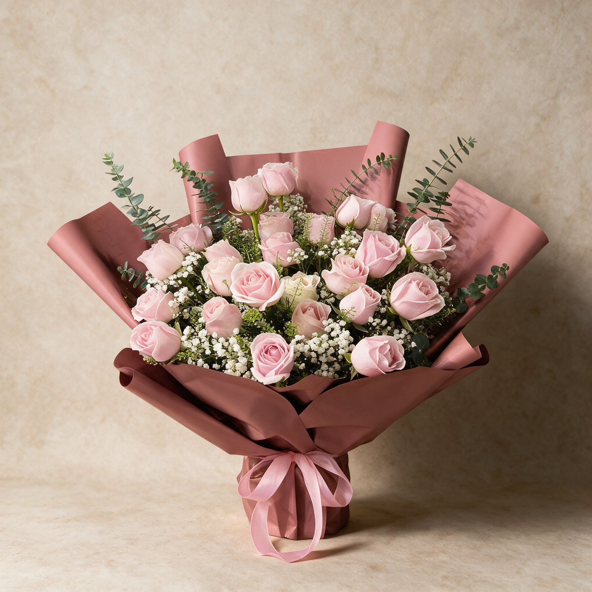 Amour fresh flower bouquet of 24 pink roses with baby’s breath and eucalyptus in dusty rose wrap