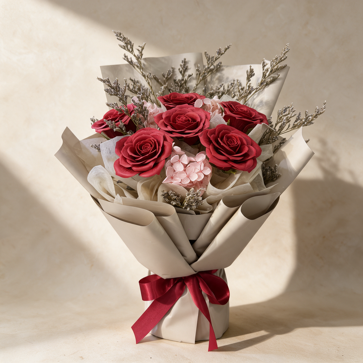 First Love soap flower bouquet of six red roses with pink hydrangea and caspia in taupe wrap
