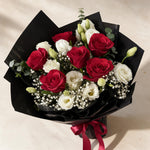 Top view of the Gentle Kiss fresh flower bouquet of six red roses with eustoma, baby’s breath and eucalyptus