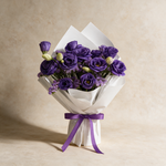 Heart Whisper fresh flower bouquet of purple eustoma and statice in white wrap