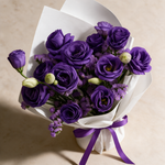 Top view of the Heart Whisper fresh flower bouquet of purple eustoma and statice