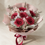 Top view of the Love Spell soap flower bouquet of six red roses with pink hydrangea and caspia