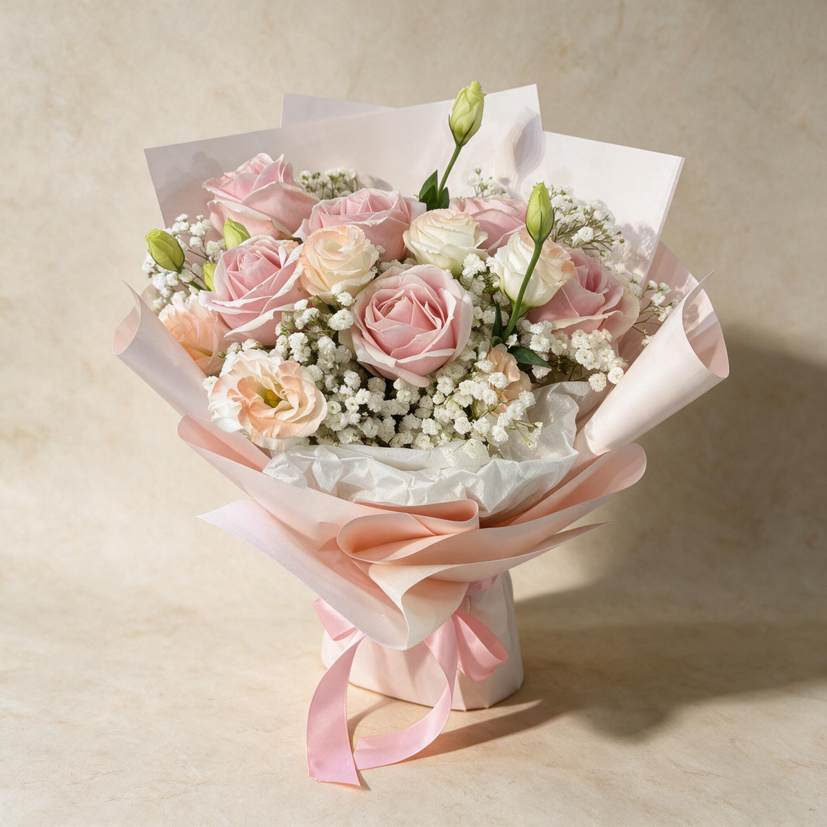 Secret Crush fresh flower bouquet of six pink roses with eustoma and baby’s breath in blush pink wrap