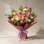 Belle fresh flower bouquet of peach gerbera daisies with pink lilies and eustoma
