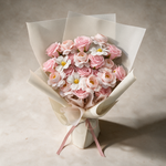 Top view of the Blossom Kiss soap flower bouquet of pink roses, ranunculus and cosmos