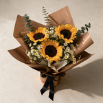 Top view of the Bravo bouquet of sunflowers and matricaria