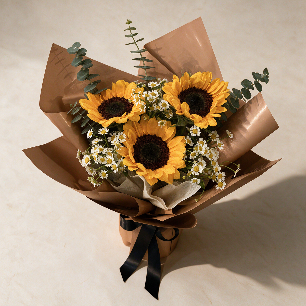 Top view of the Bravo bouquet of sunflowers and matricaria