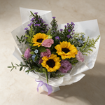 Top view of the Bright Future fresh flower bouquet of sunflowers and purple peacock flowers