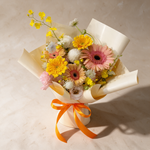 Top view of the Charming fresh flower bouquet of gerberas and ping pong chrysanthemums