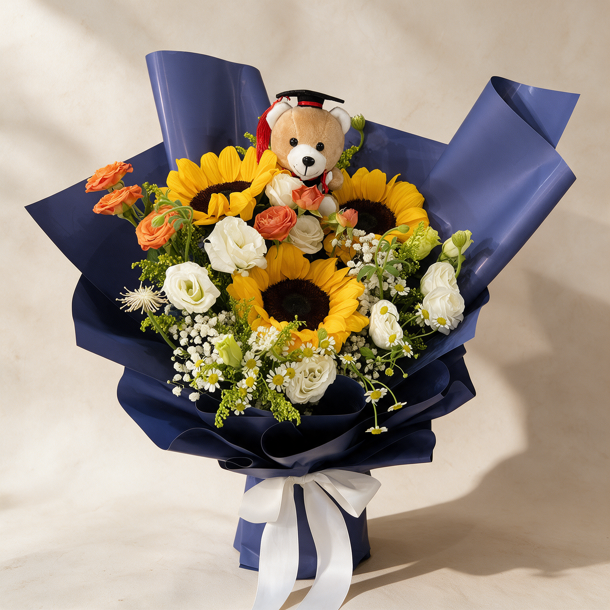 Delight fresh flower bouquet of three sunflowers with spray roses, eustoma, mini daisies and a Convo Bear