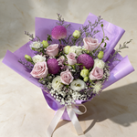 Top view of the Enchanted fresh flower bouquet of pink roses and purple chrysanthemums