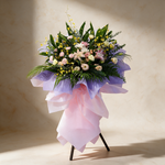 Flourish grand opening flower stand of pink and white rose lilies, carnations, eustoma and dancing lady orchids