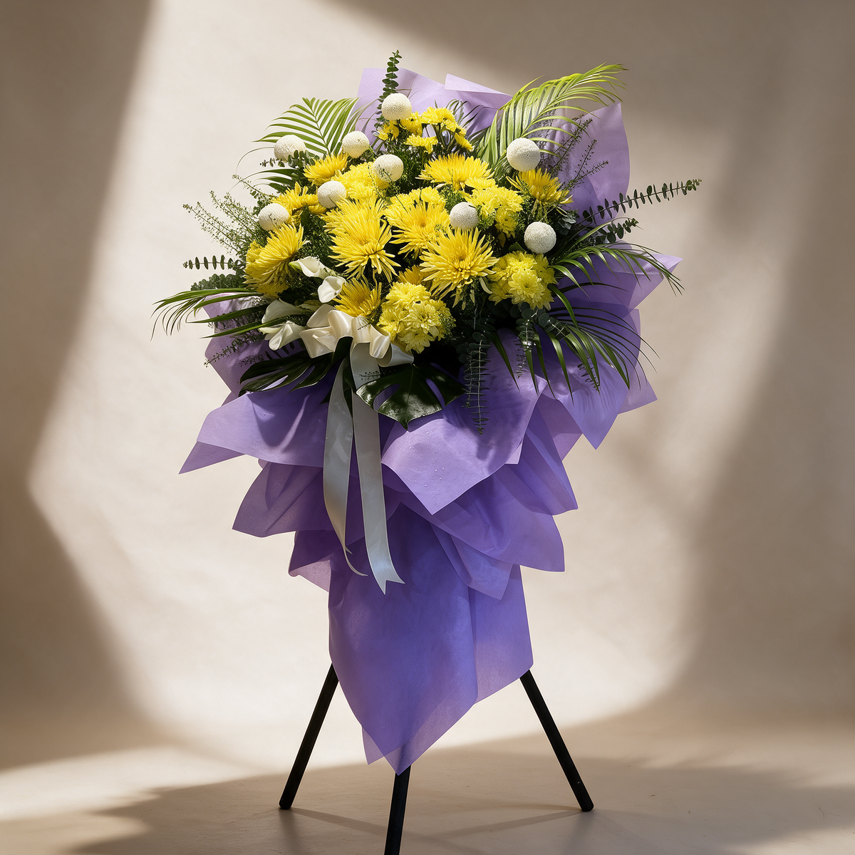 Side view of the Grace funeral flower stand of yellow chrysanthemums
