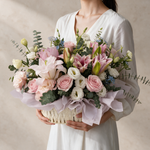 Woman holding the Heartfelt fresh flower basket