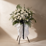 Heavenly condolence flower stand of white roses, chrysanthemums and baby’s breath