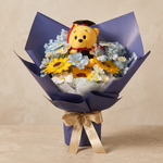 Honours soap flower bouquet of sunflowers, soft blue cosmos and chamomile with a Convo Bear