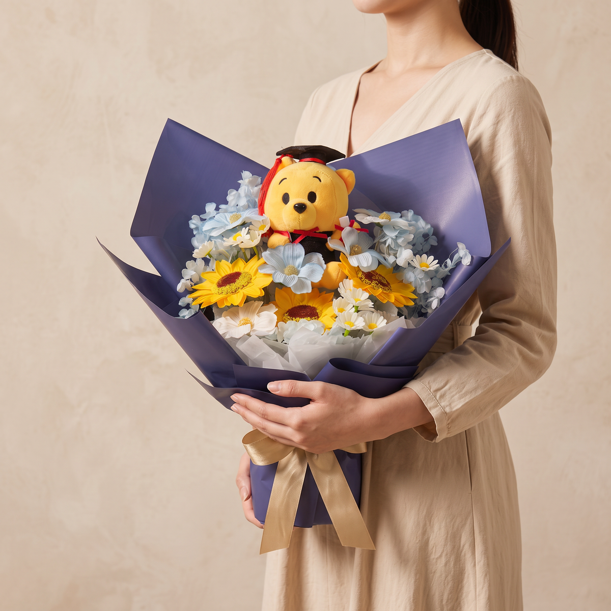 Woman holding the Honours soap flower graduation bouquet