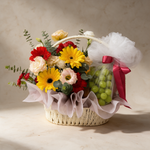 Hopeful fresh flower and fruit basket of gerbera daisies, eustoma and spray carnations with green grapes