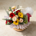 Top view of the Hopeful fresh flower and fruit basket of gerbera daisies with green grapes