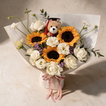 Top view of the Laurels bouquet of sunflowers, white roses and purple statice
