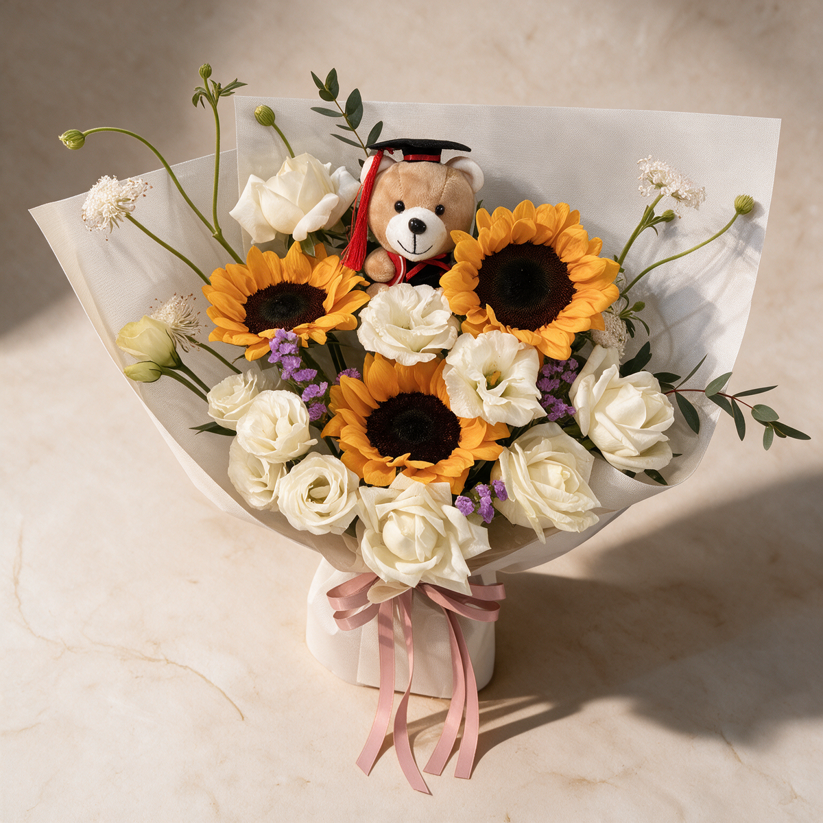 Top view of the Laurels bouquet of sunflowers, white roses and purple statice