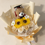 Top view of the Milestone soap flower bouquet of sunflowers, roses and gerberas
