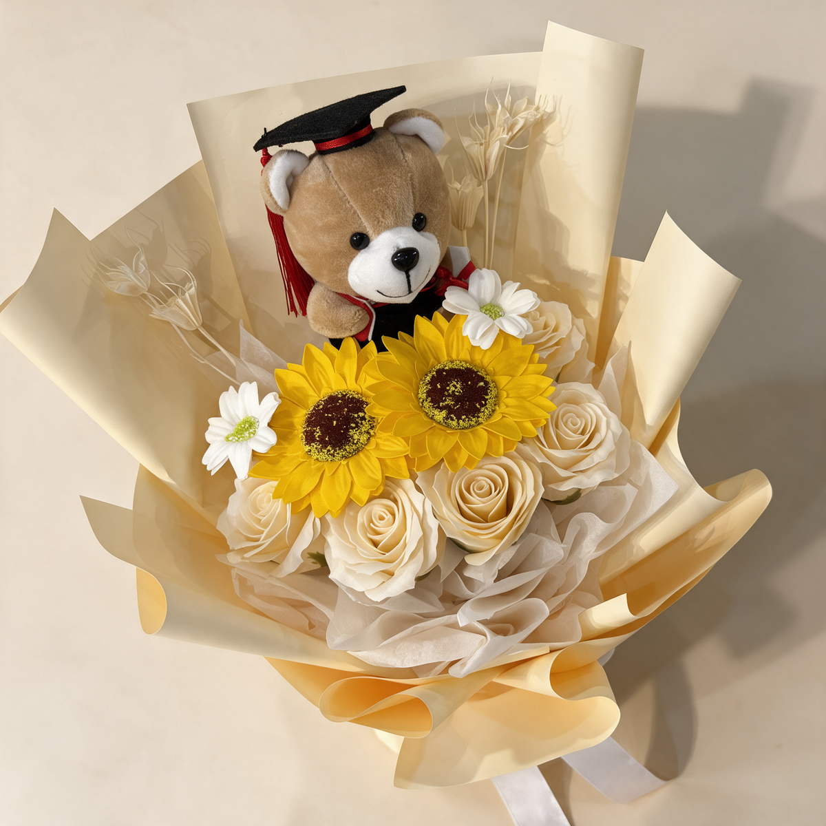 Top view of the Milestone soap flower bouquet of sunflowers, roses and gerberas