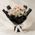 Precious fresh flower bouquet of blush pink roses with white eustoma, baby’s breath and mini daisies