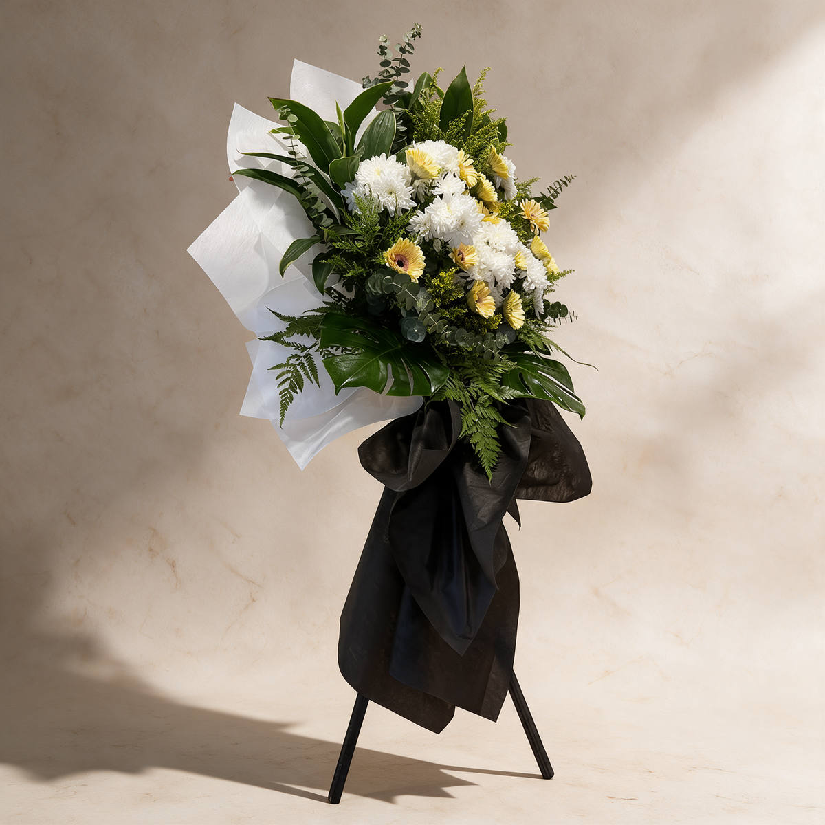 Side view of the Remembrance funeral flower stand of daisies and chrysanthemums
