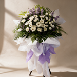 Reverence condolence flower stand of white daisies, chrysanthemums and eustoma with lilac matthiola