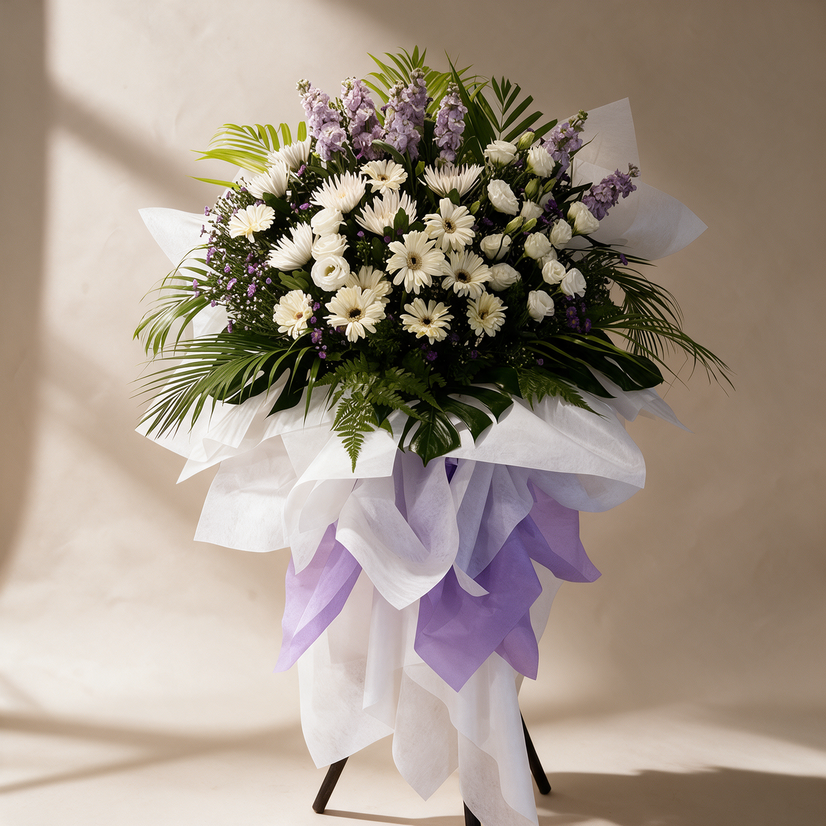 Reverence condolence flower stand of white daisies, chrysanthemums and eustoma with lilac matthiola