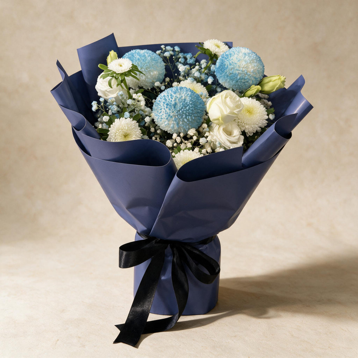 Tender Love fresh flower bouquet of three blue pingpong chrysanthemums with asters, eustoma and baby’s breath in navy wrap