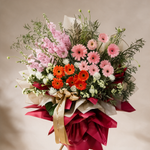 Close-up of the Thrive grand opening flower stand of pink and orange gerberas and matthiola